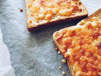 Close-up of bread toasted with cheese served on table