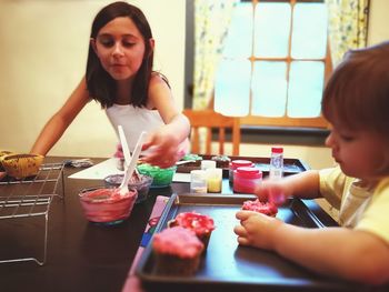 Young woman preparing food on table