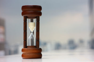 Close-up of hourglass on table