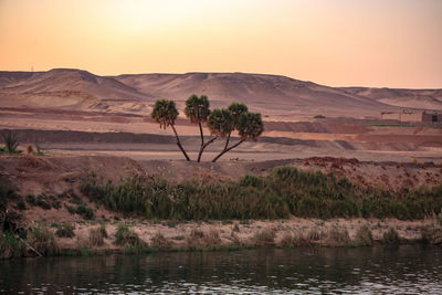 Scenic view of landscape against sky during sunset