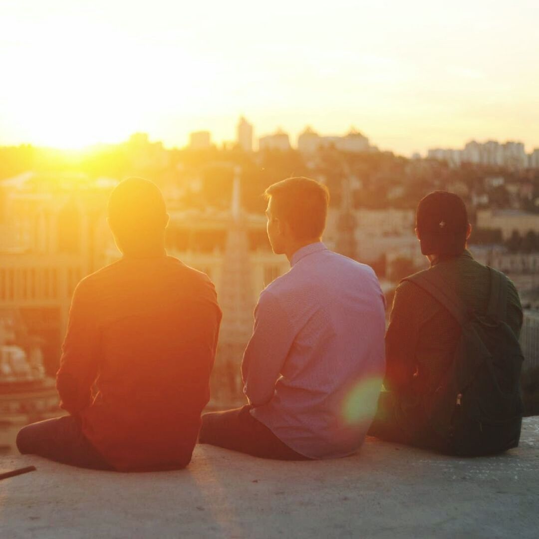 sunset, togetherness, men, rear view, relaxation, lens flare, sunlight, sitting, two people, friendship, lifestyles, adult, women, sun, adults only, outdoors, bonding, people, happiness, only men, young adult, couple, sky, day