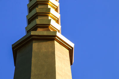 Low angle view of building against clear blue sky