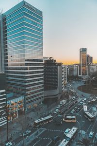 High angle view of city street and buildings against sky