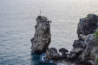 High angle view of rock formation in sea