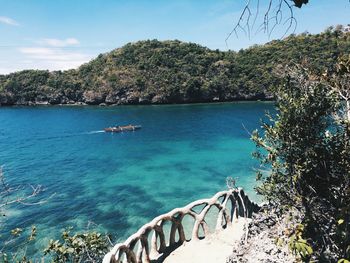 Scenic view of sea against blue sky