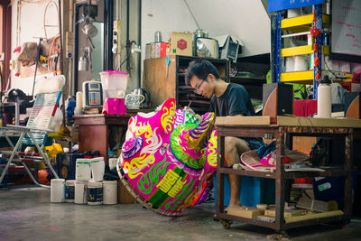 Woman working at market stall