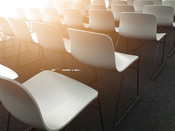 High angle view of chairs on table