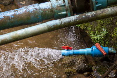 High angle view of water falling from pipe