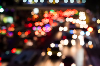 Defocused image of illuminated lights at night