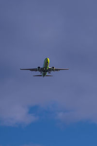 Low angle view of airplane against sky