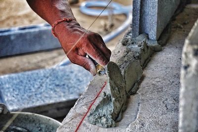 Close-up of man working at construction site