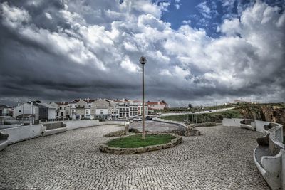 View of road against cloudy sky