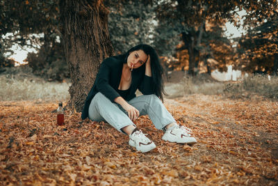 Young woman sitting on field