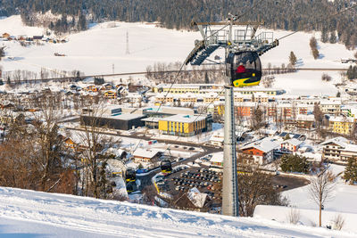 High angle view of snow covered buildings in city