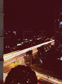 Light trails on road in city at night