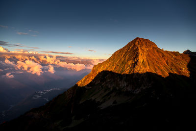 Scenic view of mountains against sky during sunset