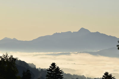 Scenic view of silhouette mountains against clear sky