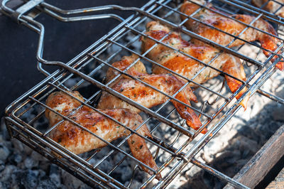 Close-up of meat on barbecue grill