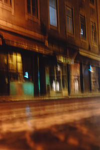 Defocused image of illuminated building at night