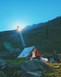 Tent on mountain against clear sky