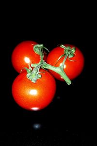 Close-up of red object over black background