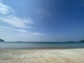 Scenic view of sea against blue sky