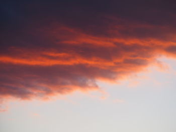 Low angle view of orange cloudy sky