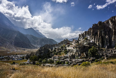 Scenic view of landscape against cloudy sky