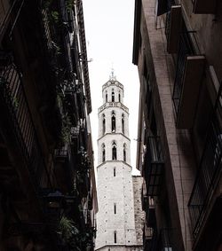 Low angle view of bell tower against sky