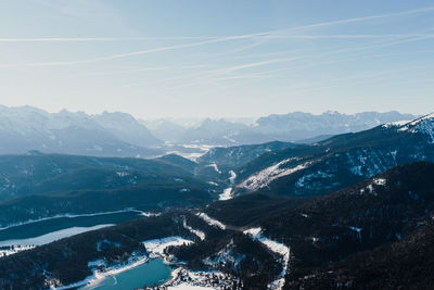 Aerial view of snowcapped mountains against sky
