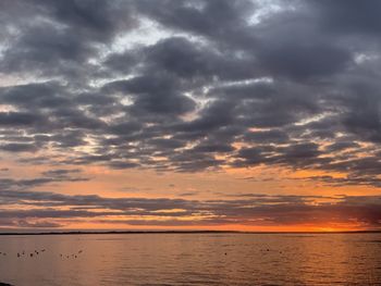 Scenic view of sea against sky at sunset