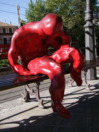 Close-up of red bell on tree in city