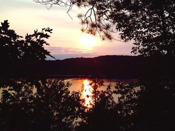 Scenic view of lake at sunset