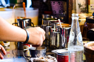 Midsection of man preparing food in restaurant