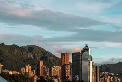 Buildings in city against sky