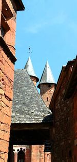 Low angle view of bell tower against sky