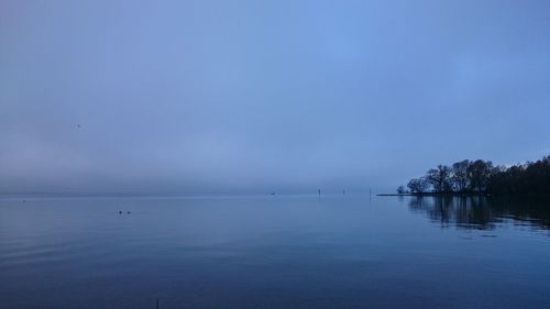 Scenic view of sea against blue sky