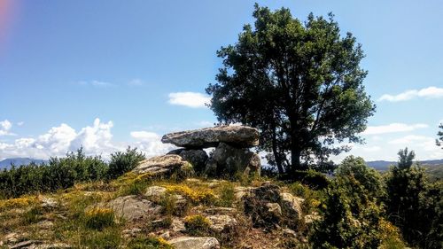 Low angle view of rocks against sky
