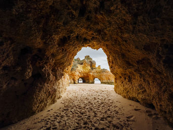 Rear view of man standing in tunnel