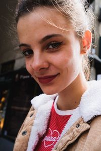 Close-up portrait of a smiling young woman