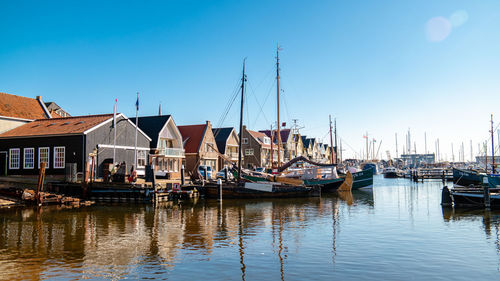 Boats moored at harbor