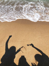 Shadow of people on beach