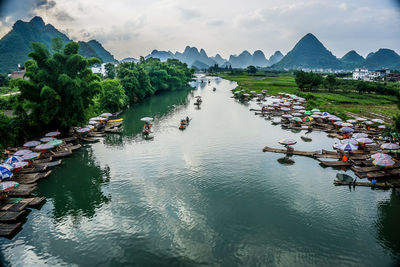 High angle view of boats in river against sky