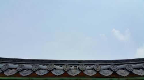 Low angle view of roof against sky