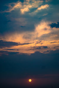 Low angle view of cloudy sky at sunset