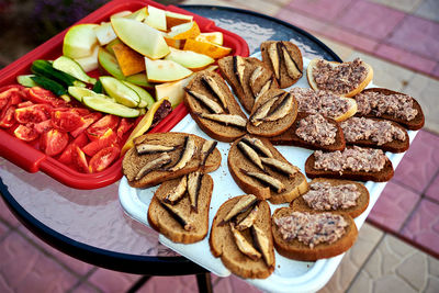 High angle view of cold food served on table outdoors