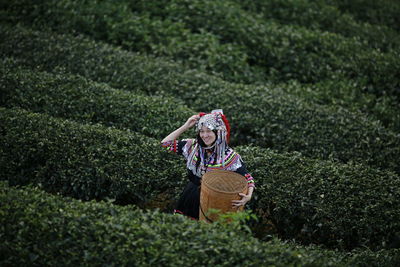 Woman wearing hat on field