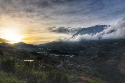 Scenic view of landscape against sky during sunset