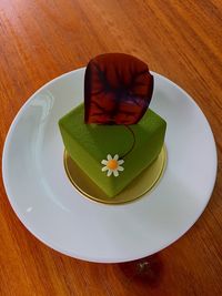 High angle view of dessert in plate on wooden table