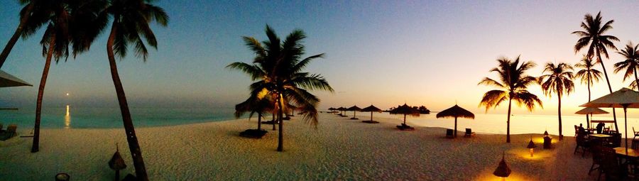 Scenic view of beach against sky during sunset